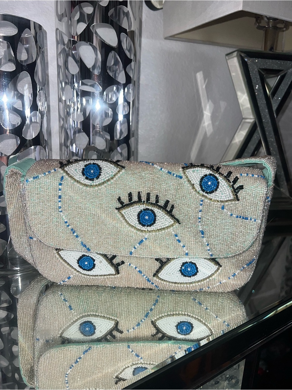 Embellished Beaded Eye shoulder Bag in Light Gray with Blue Accents